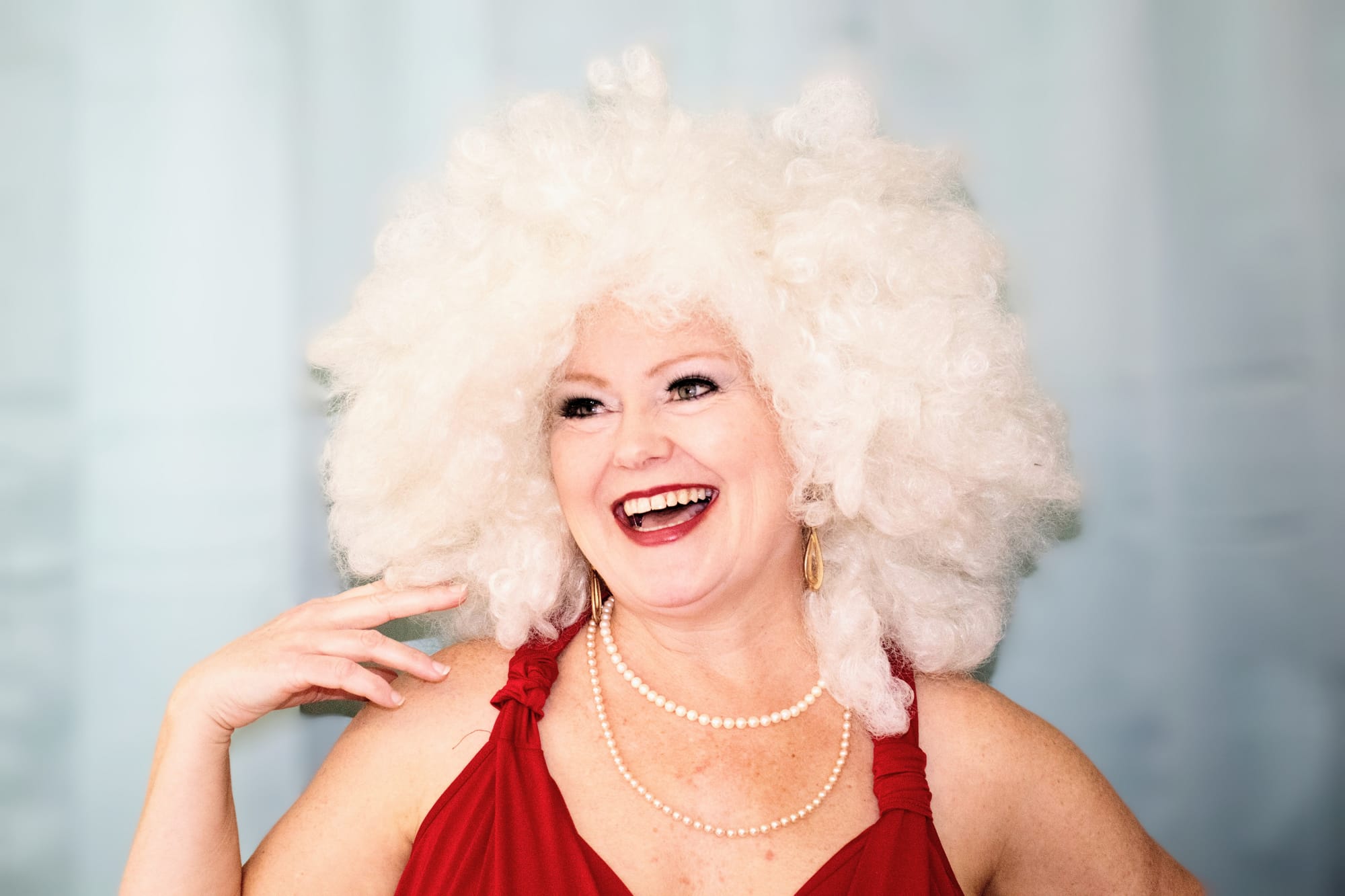 Theresa Goodrich in large white wig