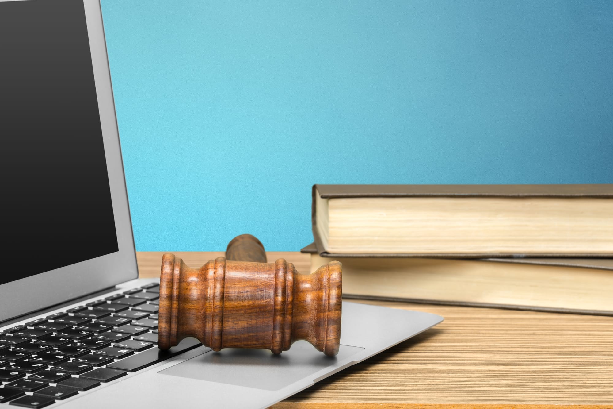 Computer, books, and judge’s gavel