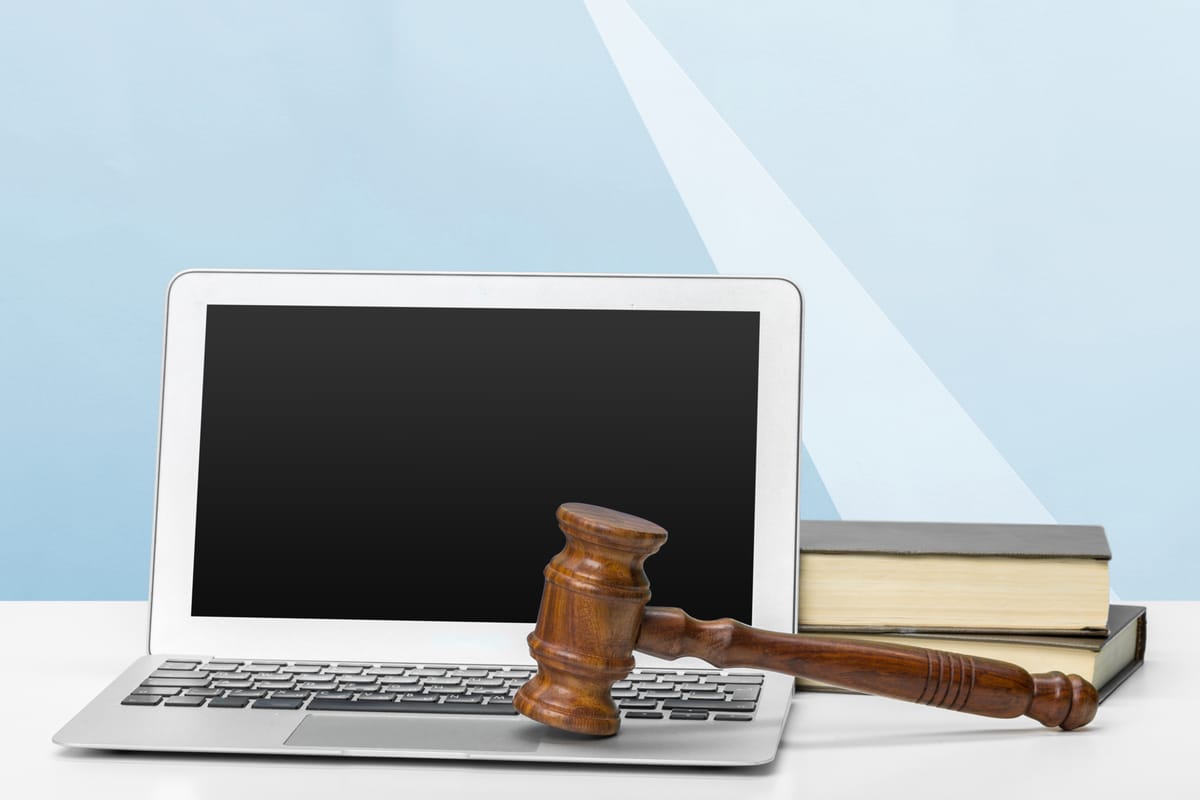 Computer, books, and judge’s gavel