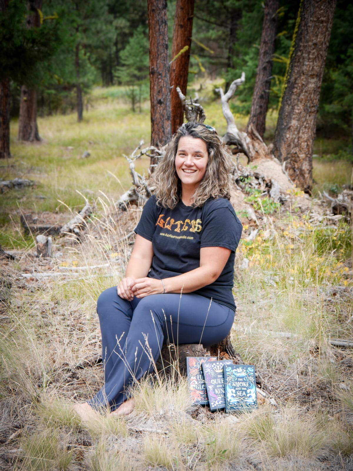 Katie Cross with copies of her books