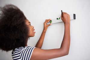 young black woman doing diy at home