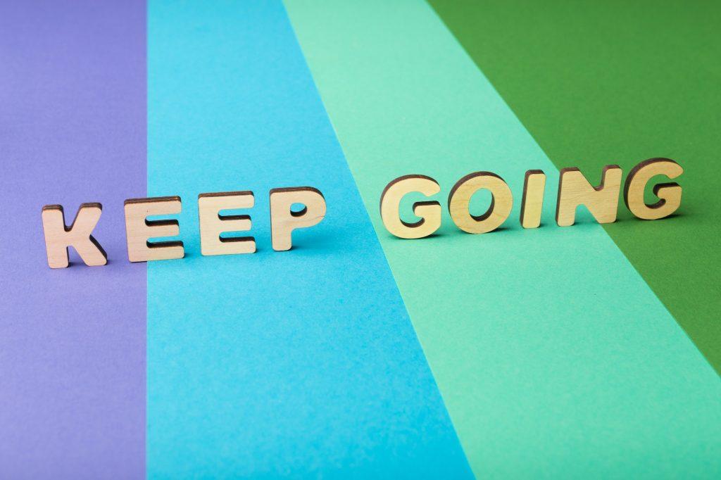 Keep going inscription on colorful background